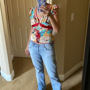 Asian inspired plunge neck top with ruffled cap sleeves